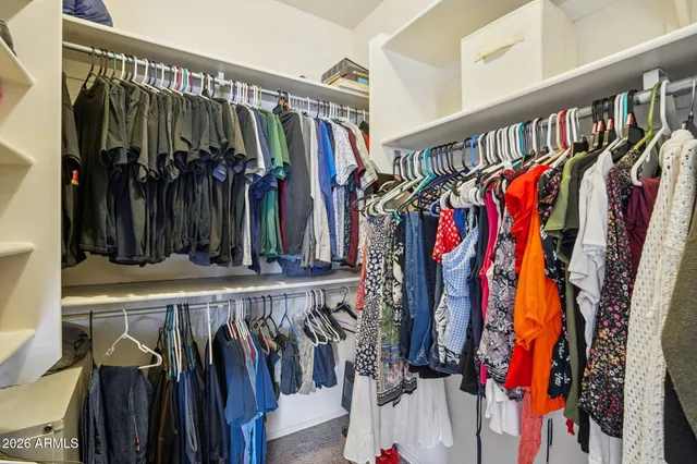 a bathroom with double vanity sinks and a bathtub