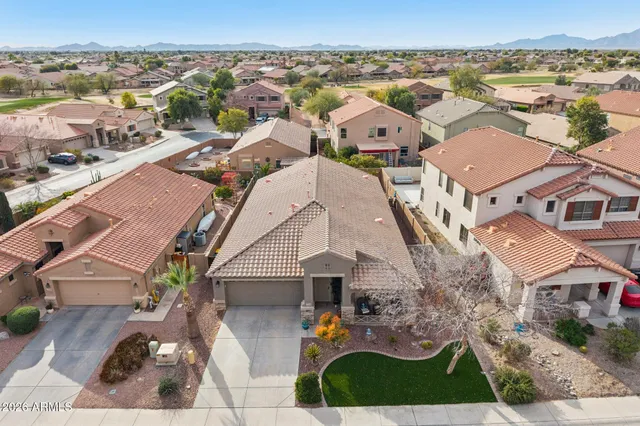 a view of a swimming pool with a yard