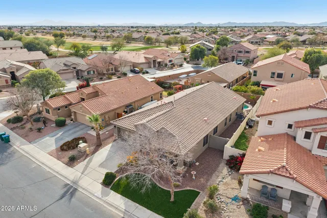 an aerial view of residential houses with outdoor space
