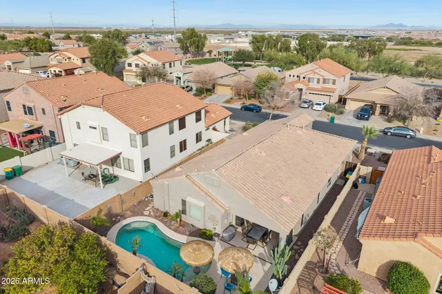 an aerial view of residential houses with outdoor space