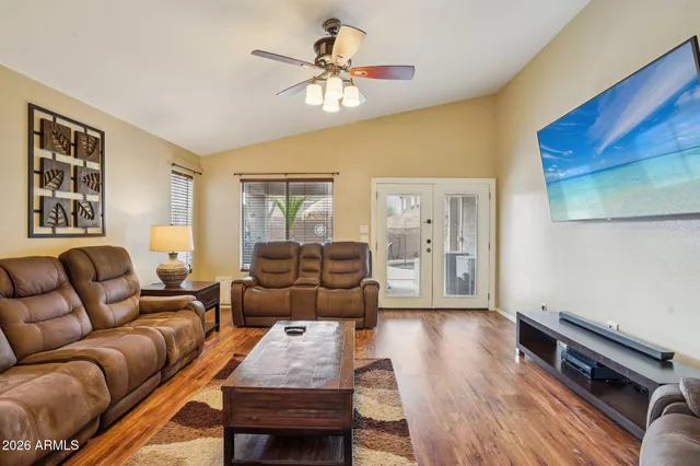 a living room with furniture and a large window
