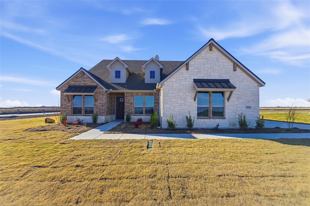 2050 County Road 200 Valley View, TX 76272 - Photo 3 of 31 View of front facade with a front yard, stone siding, and brick siding