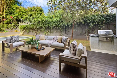 a outdoor living space with furniture and a potted plant