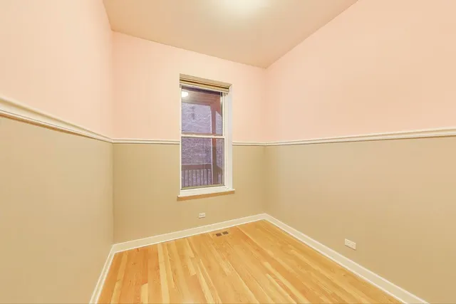 a view of a room with a wooden floor