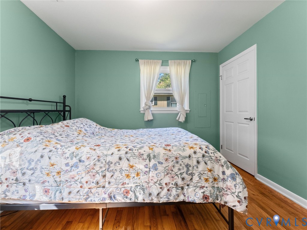 408 Howerton Road Tappahannock, VA 22560 - Photo 24 of 49 Hardwood flooring, painted walls, white trim, and