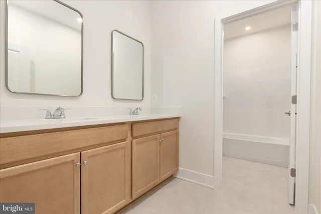 a white toilet sitting next to a bath tub