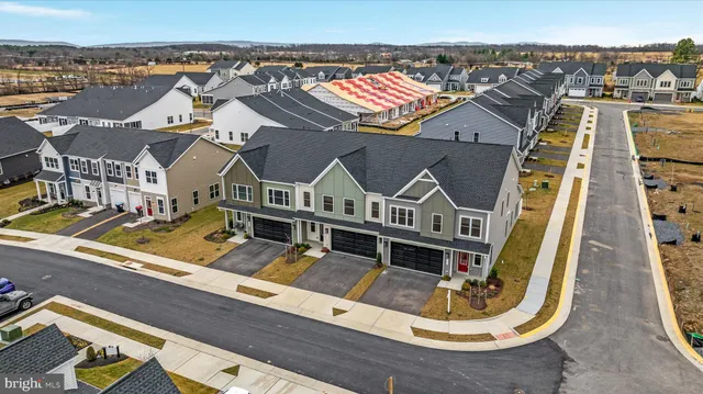 an aerial view of a house with a ocean view