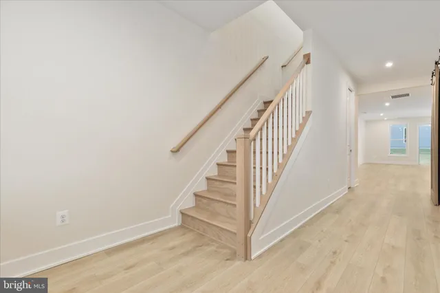 a view of entryway with wooden floor