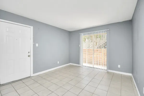 a view of an empty room and window