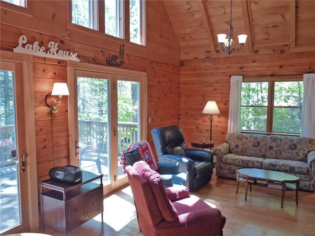 75 Brooks And Dunn Road Otis, ME 04605 - Photo 13 of 35 Living room with cathedral ceiling...
