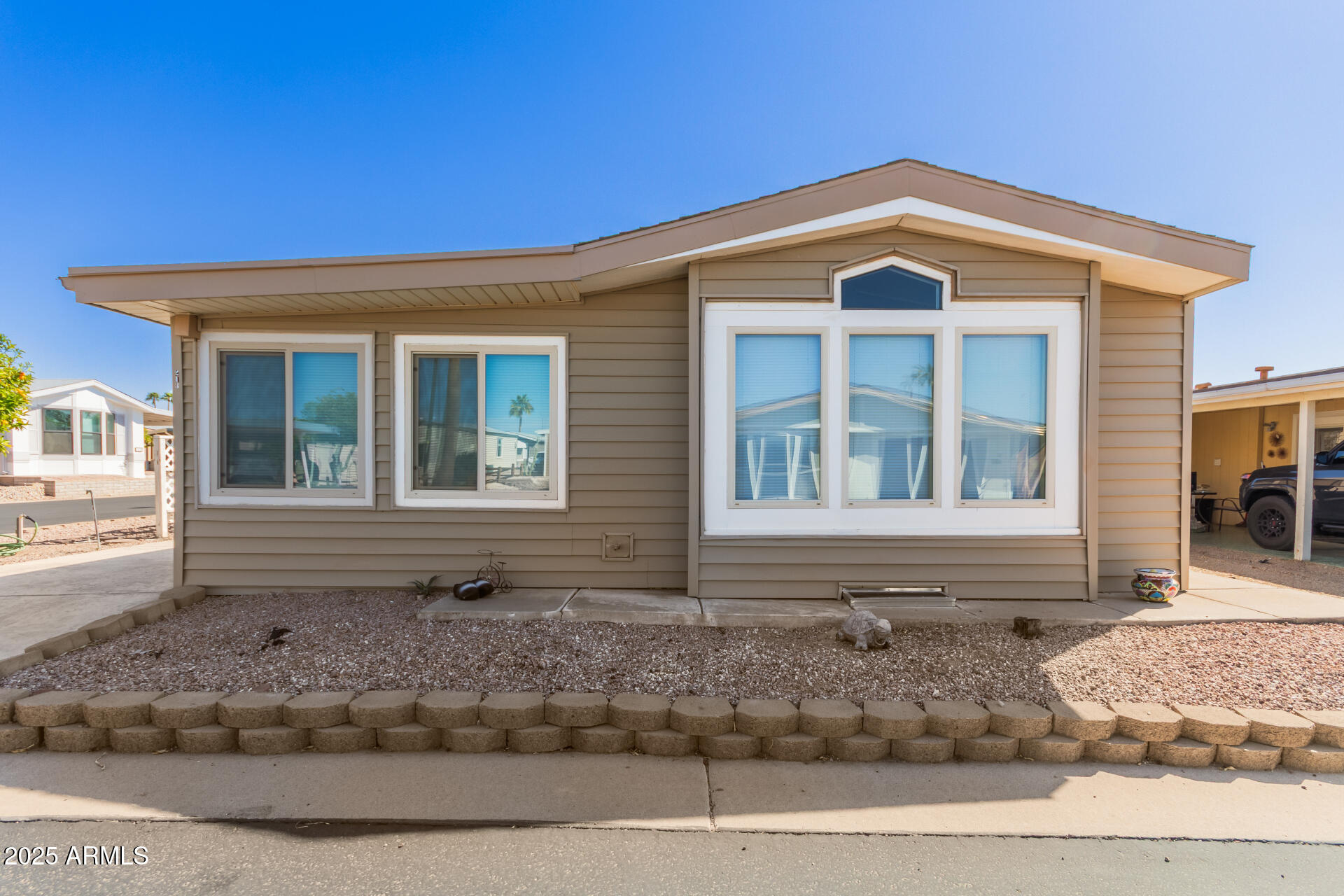 5735 East McDowell Road, Unit 213 Mesa, AZ 85215 - Photo 1 of 18 a front view of a house
