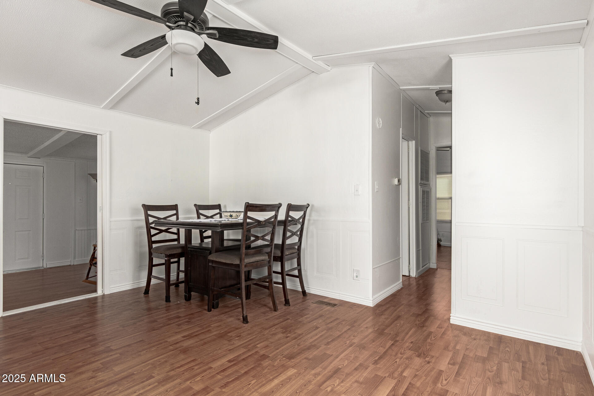 5735 East McDowell Road, Unit 213 Mesa, AZ 85215 - Photo 11 of 18 a view of a dining room with furniture and wooden floor