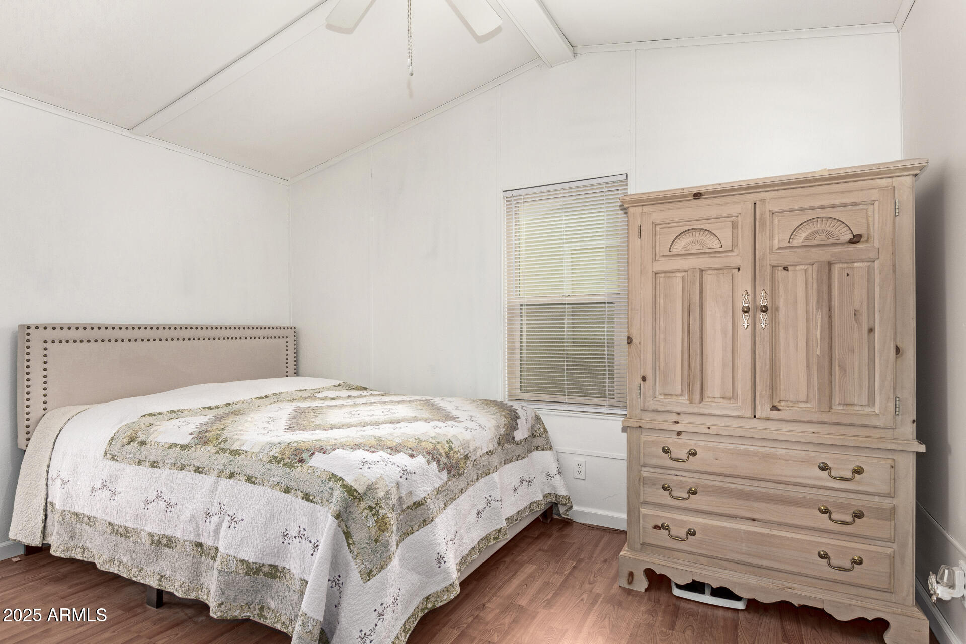 5735 East McDowell Road, Unit 213 Mesa, AZ 85215 - Photo 14 of 18 a bedroom with a bed and a dresser