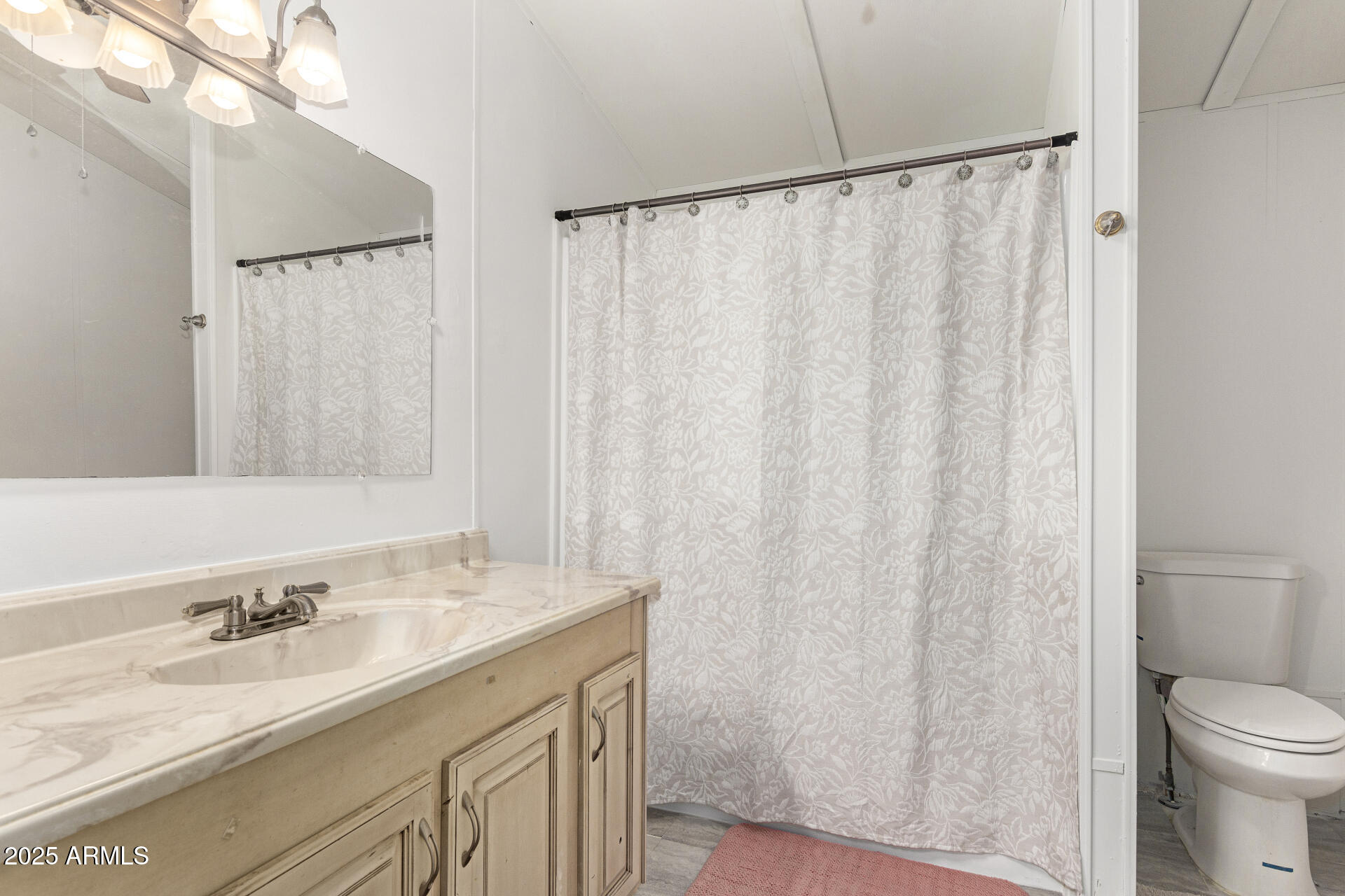 5735 East McDowell Road, Unit 213 Mesa, AZ 85215 - Photo 15 of 18 a bathroom with a granite countertop sink and a mirror