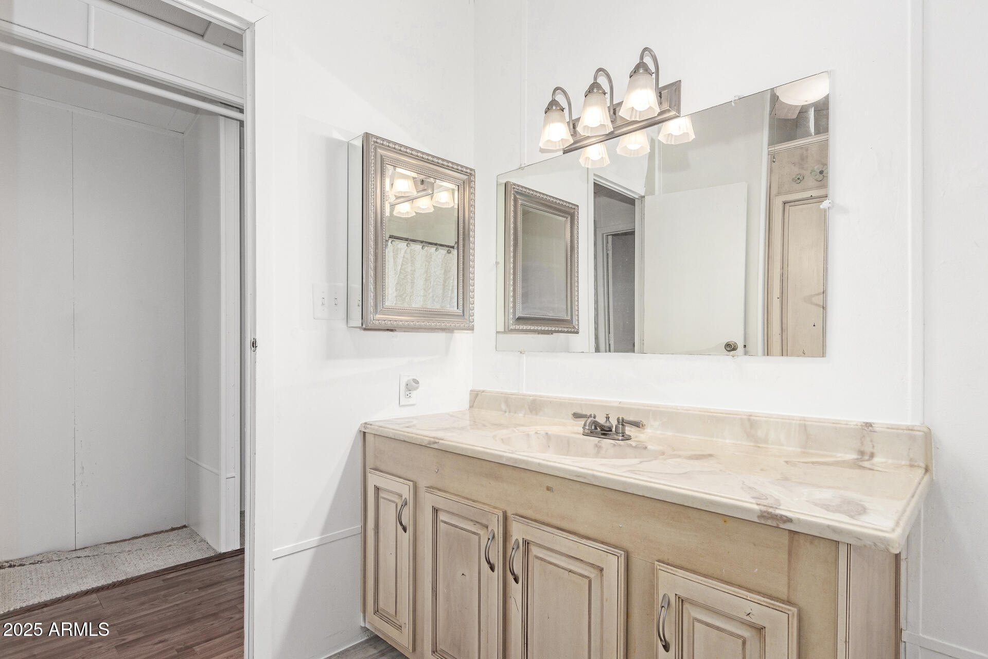 5735 East McDowell Road, Unit 213 Mesa, AZ 85215 - Photo 16 of 18 a bathroom with a granite countertop sink and a mirror