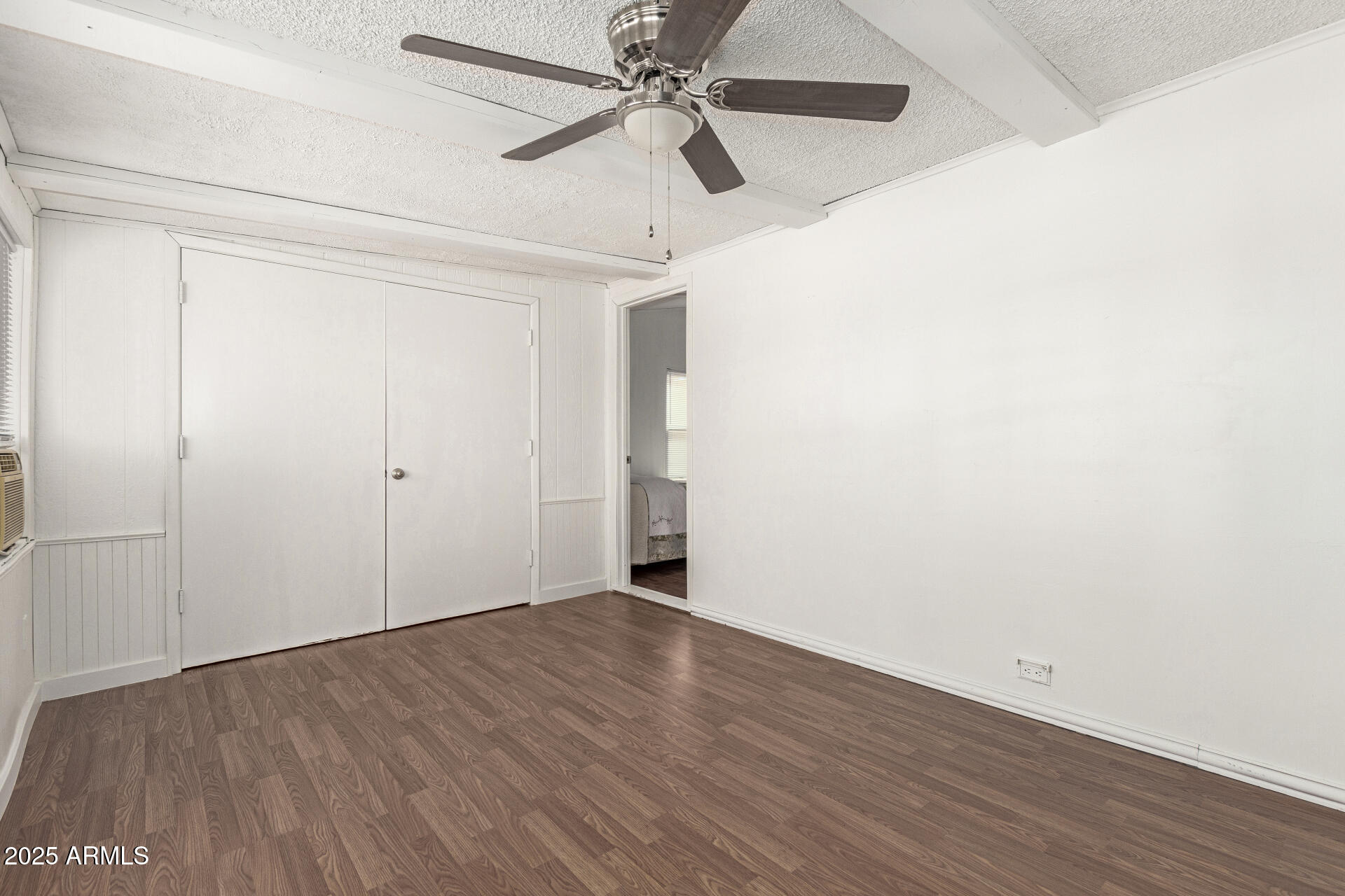 5735 East McDowell Road, Unit 213 Mesa, AZ 85215 - Photo 18 of 18 a view of an empty room with wooden floor