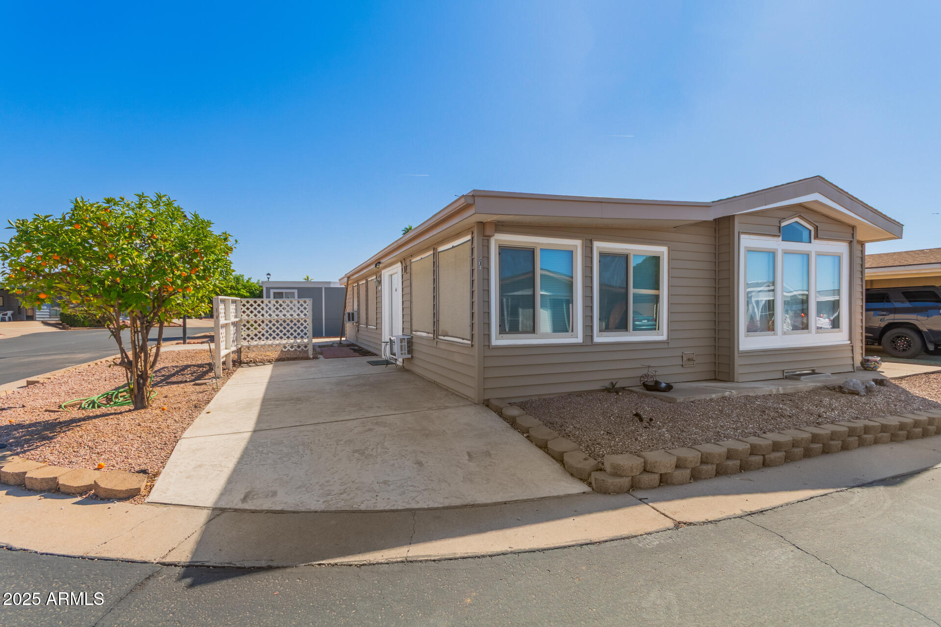 5735 East McDowell Road, Unit 213 Mesa, AZ 85215 - Photo 2 of 18 a house view with a outdoor space