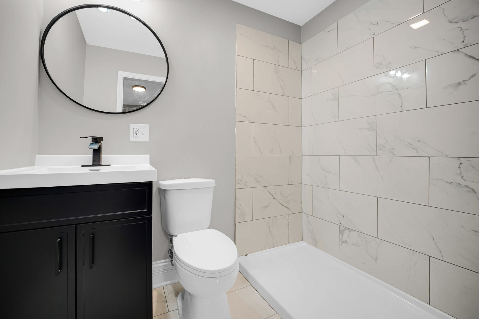 7621 South Normal Avenue Chicago, IL 60620 - Photo 11 of 32 a bathroom with a sink a toilet and a mirror