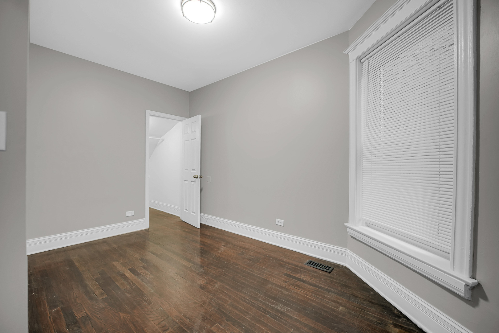 7621 South Normal Avenue Chicago, IL 60620 - Photo 14 of 32 a view of an empty room with wooden floor
