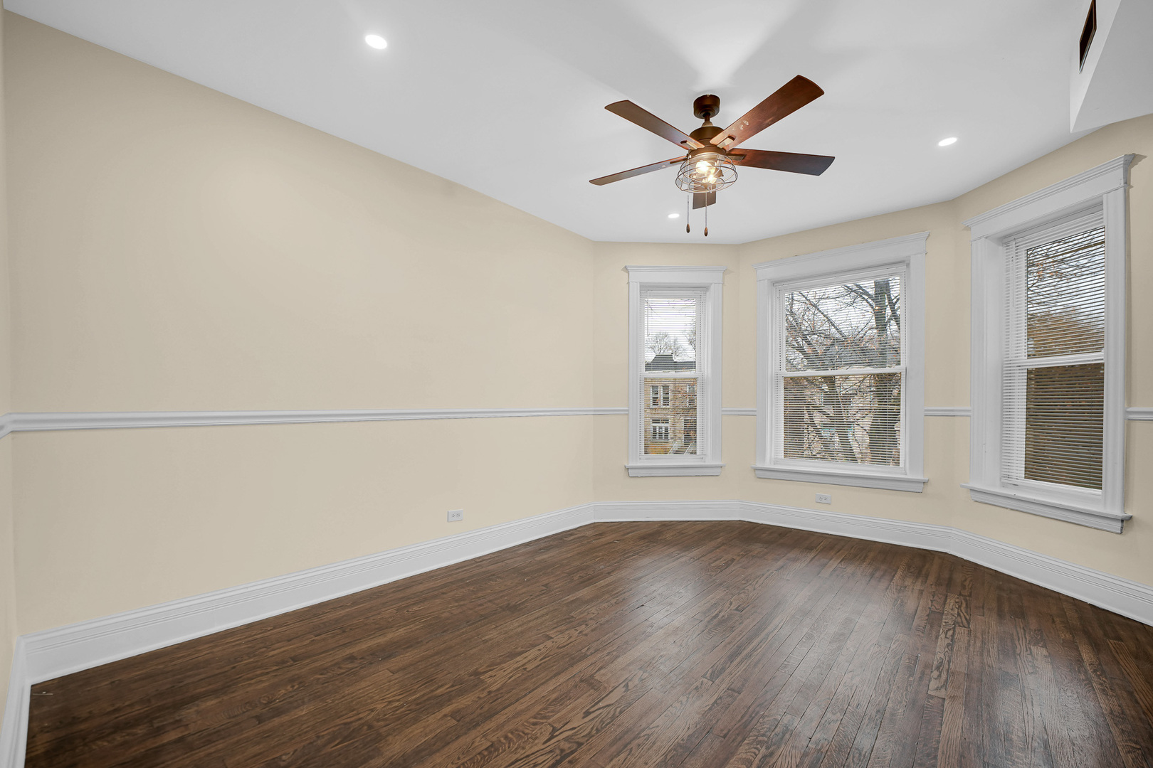 7621 South Normal Avenue Chicago, IL 60620 - Photo 17 of 32 wooden floor in an empty room with a window