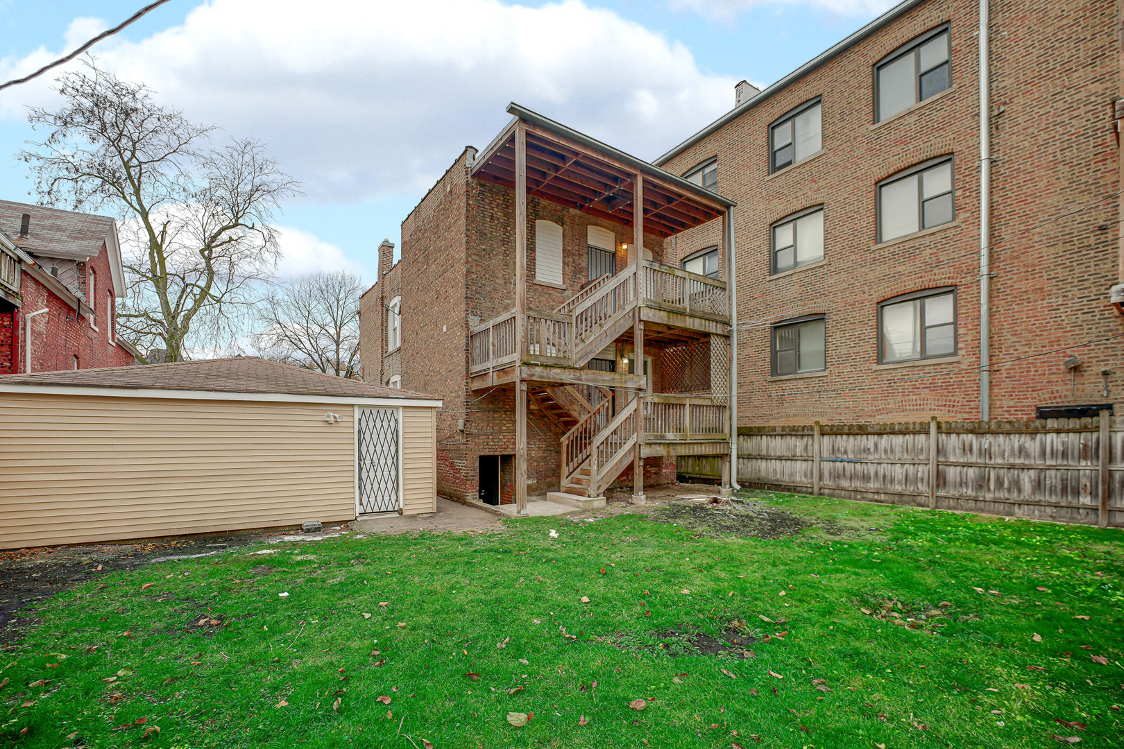 7621 South Normal Avenue Chicago, IL 60620 - Photo 6 of 32 a view of a house with a yard and sitting area