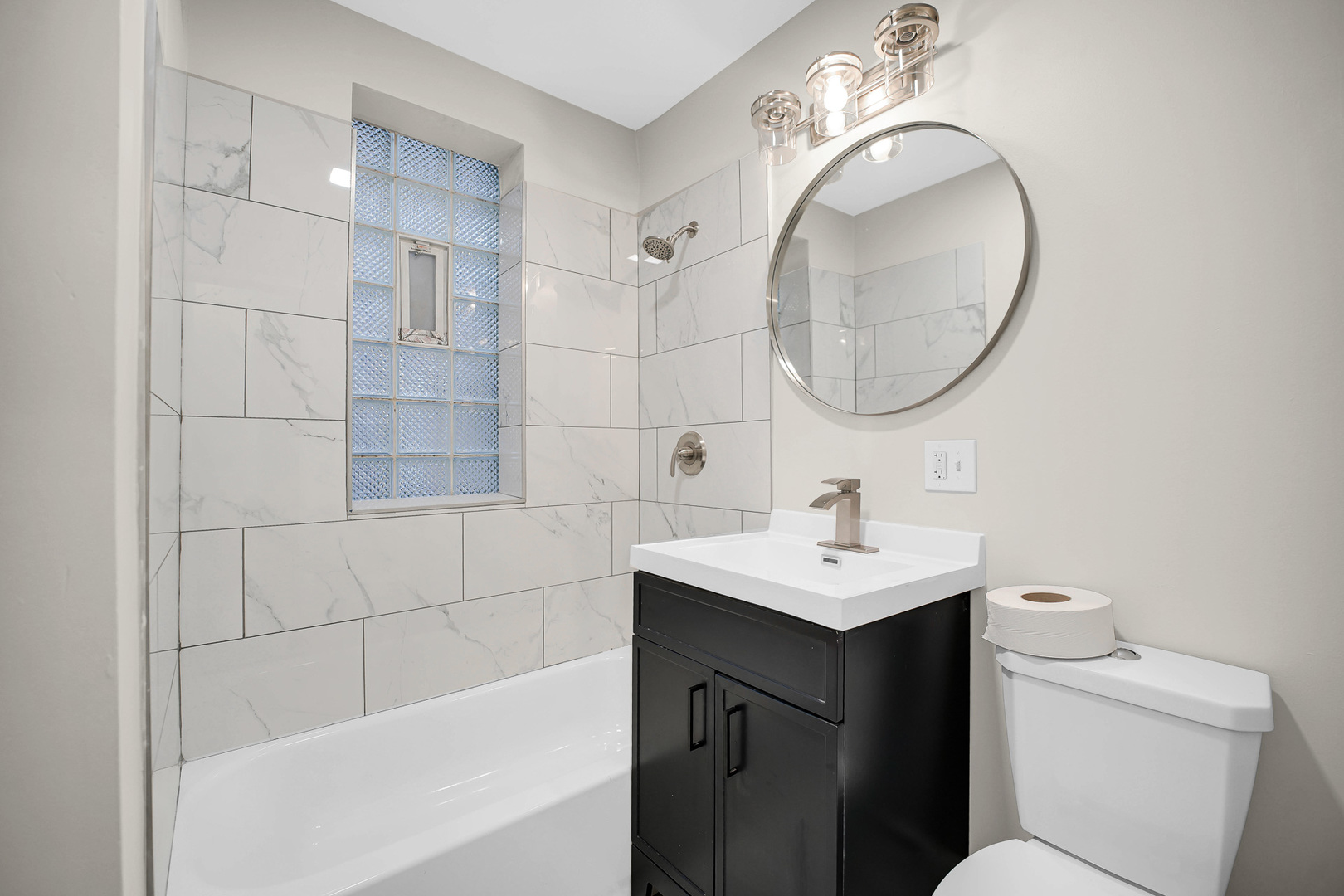 7621 South Normal Avenue Chicago, IL 60620 - Photo 9 of 32 a bathroom with a sink toilet and shower