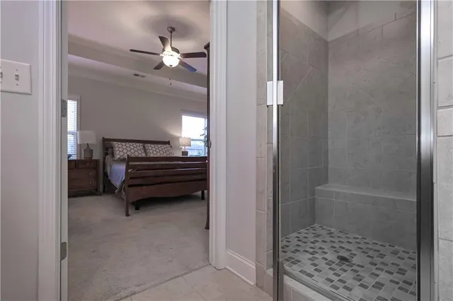 a view of a livingroom with hardwood floor and a ceiling fan