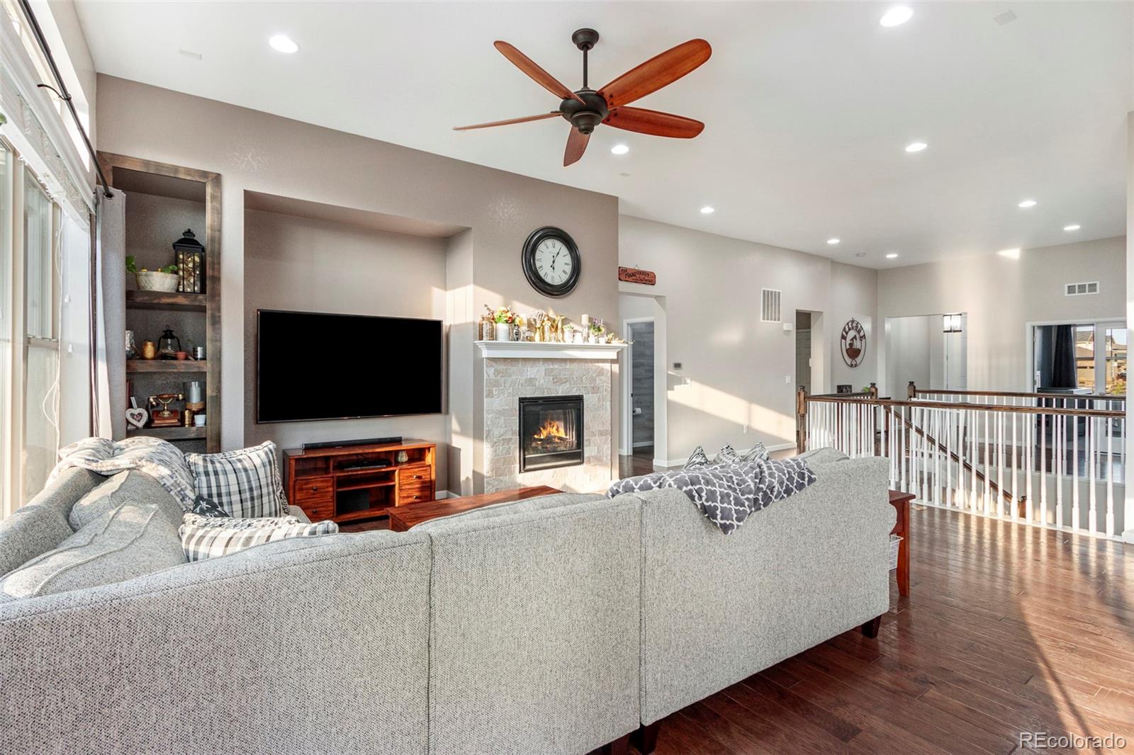 8875 Flattop Way Arvada, CO 80007 - Photo 11 of 38 a living room with furniture and a flat screen tv