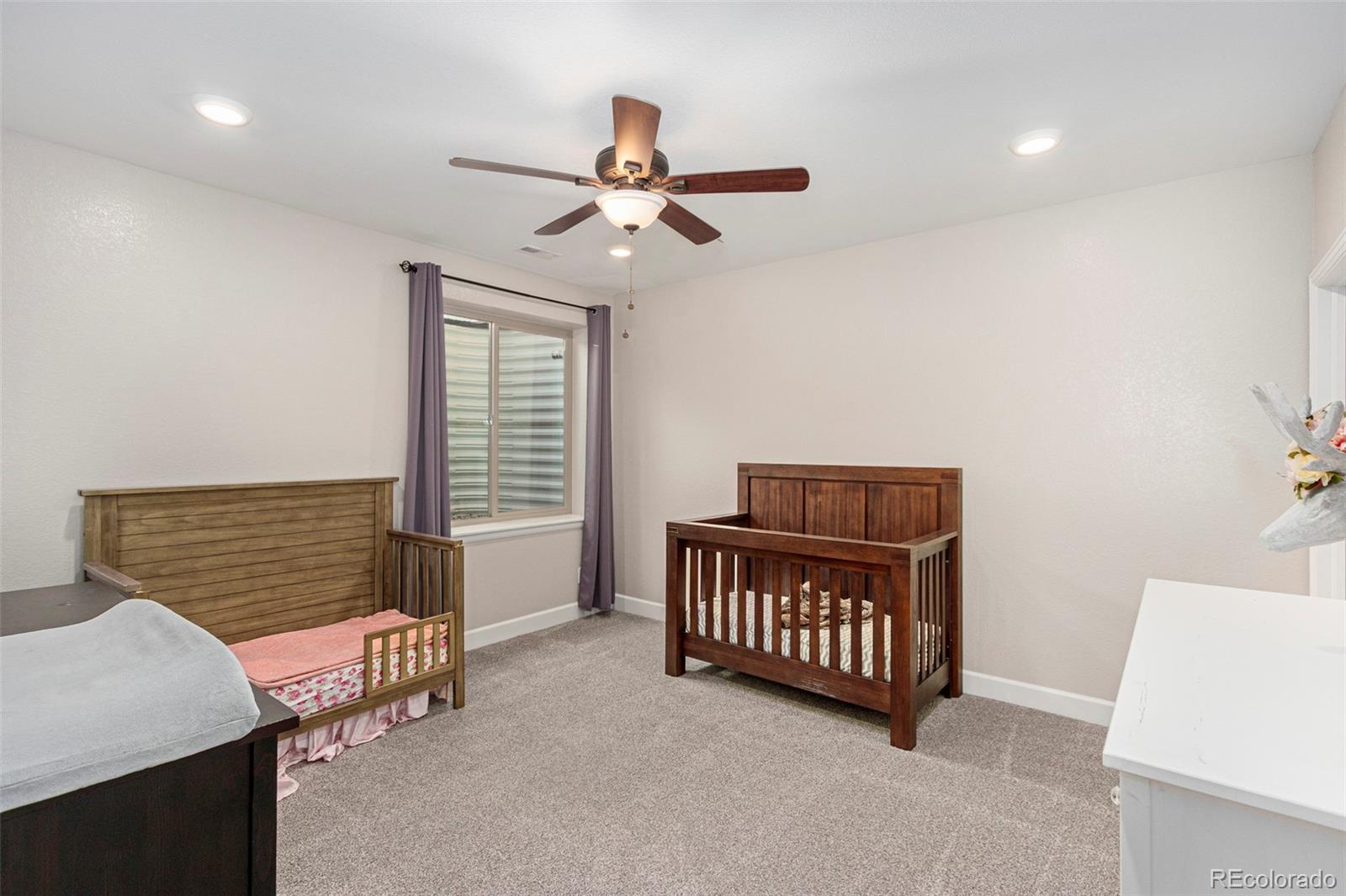 8875 Flattop Way Arvada, CO 80007 - Photo 24 of 38 a view of a room with furniture and a window