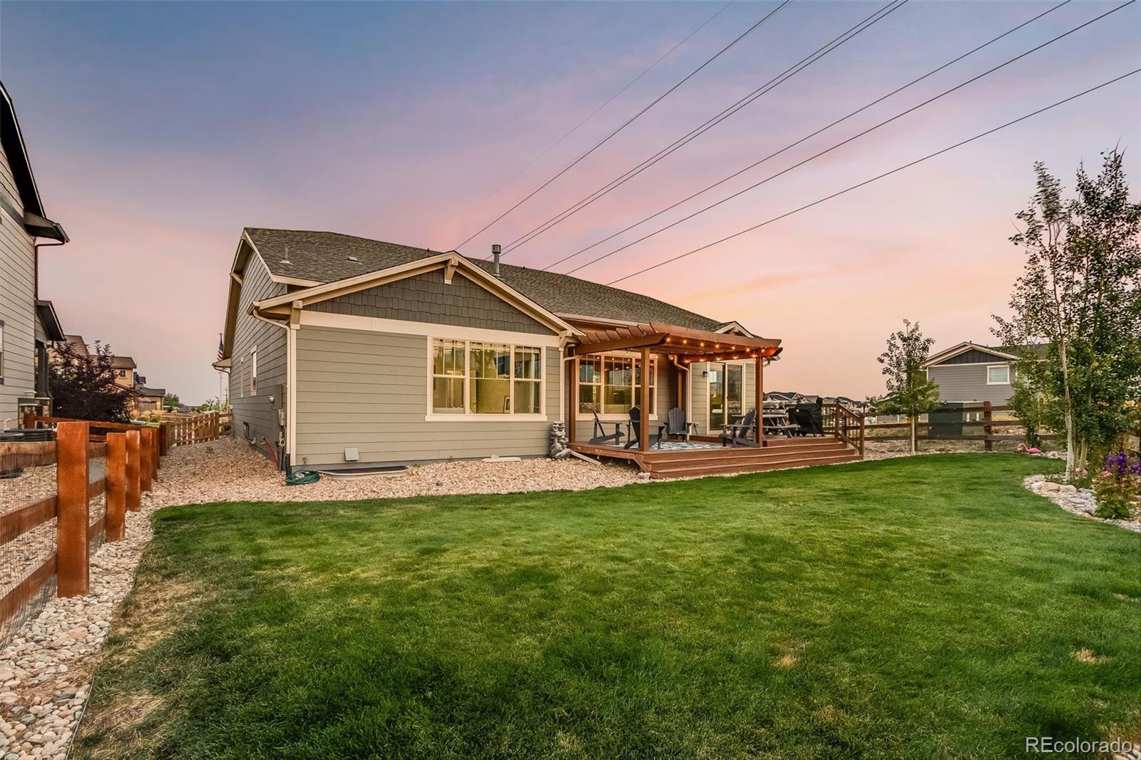8875 Flattop Way Arvada, CO 80007 - Photo 34 of 38 a front view of a house with a garden