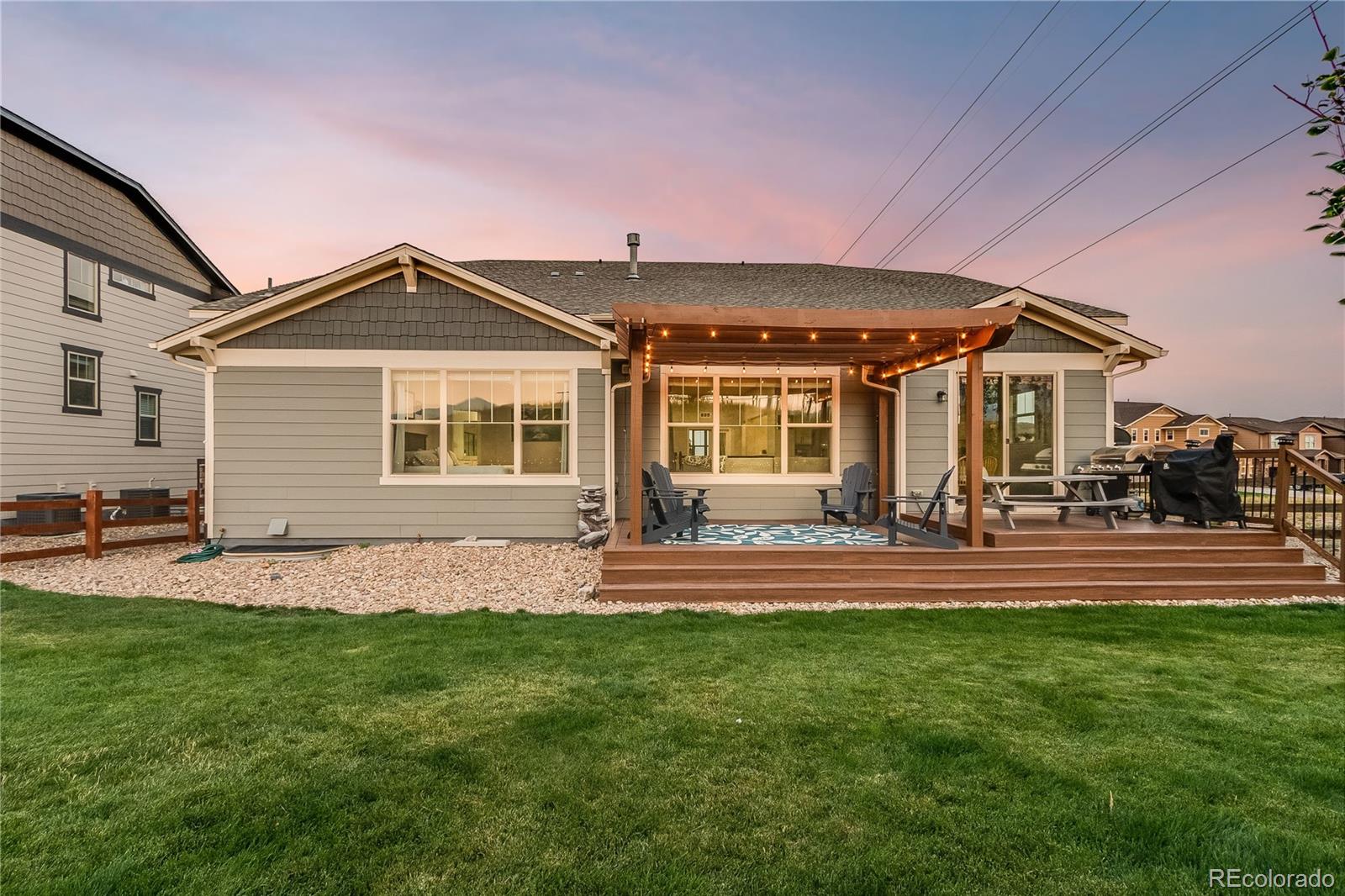 8875 Flattop Way Arvada, CO 80007 - Photo 35 of 38 a front view of a house with a yard