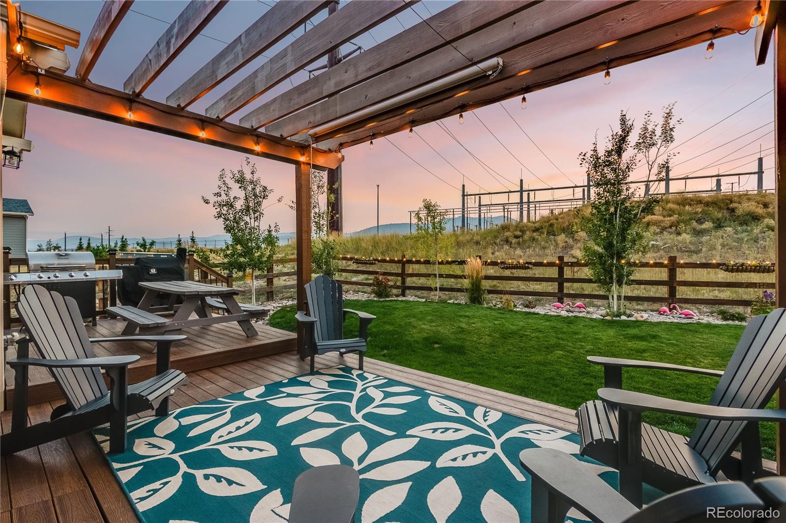 8875 Flattop Way Arvada, CO 80007 - Photo 4 of 38 a view of yard from deck with patio