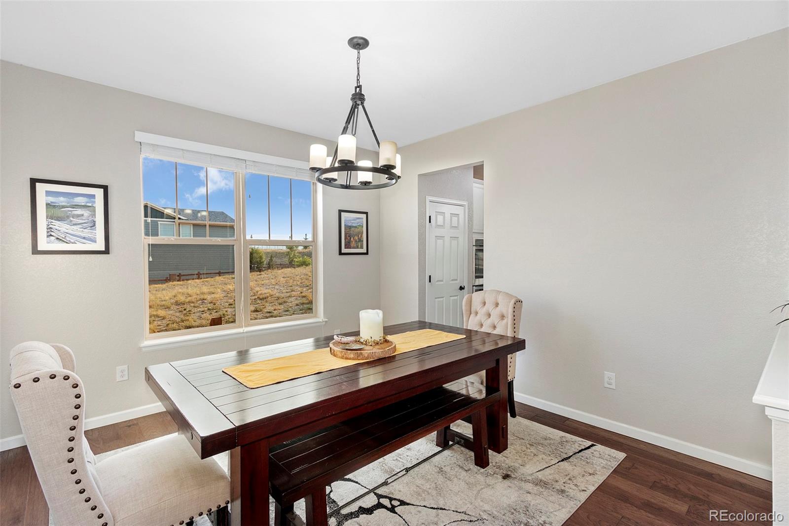 8875 Flattop Way Arvada, CO 80007 - Photo 7 of 38 a view of a dining room with furniture