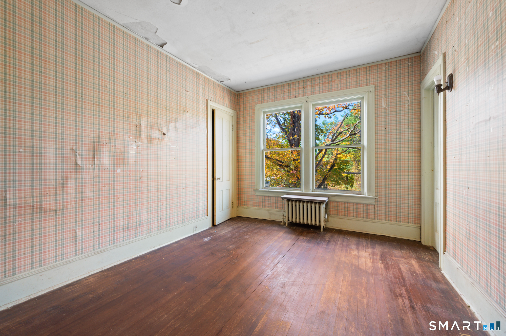 124 River Road Willington, CT 06279 - Photo 35 of 40 an empty room with wooden floor and windows