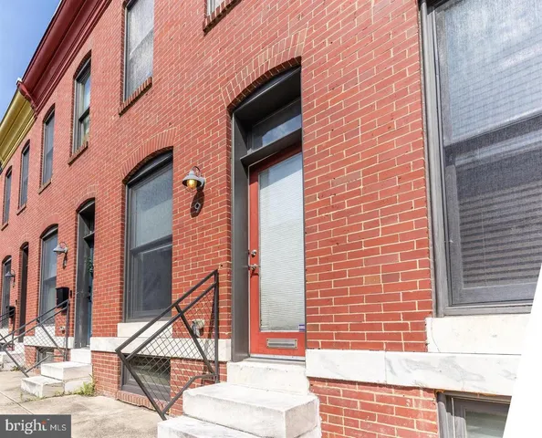 a view of front door of house with a street