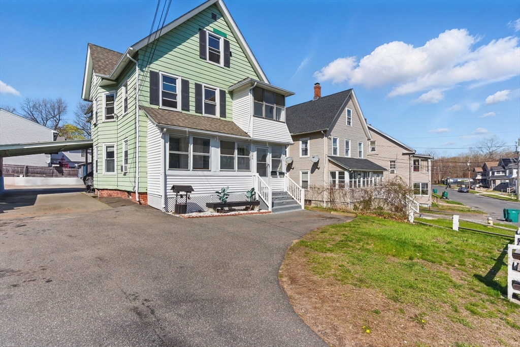 front view of a house with a yard