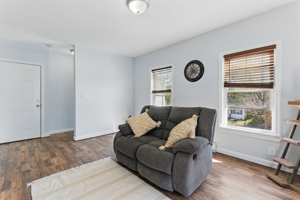 166-168 Corthell Street Springfield, MA 01151 - Photo 15 of 33 a living room with furniture and a window