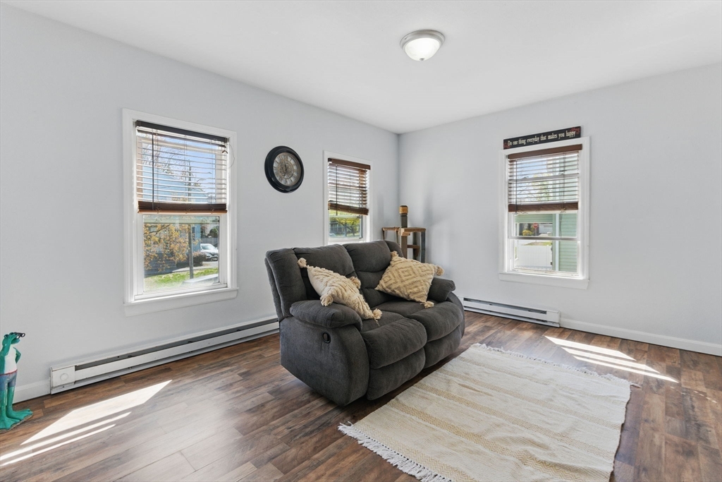 166-168 Corthell Street Springfield, MA 01151 - Photo 17 of 33 a living room with furniture and a window
