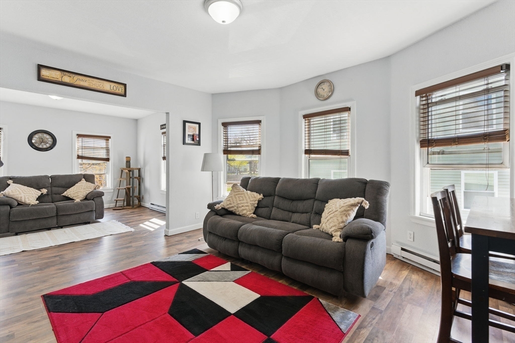 166-168 Corthell Street Springfield, MA 01151 - Photo 19 of 33 a living room with furniture and a lamp