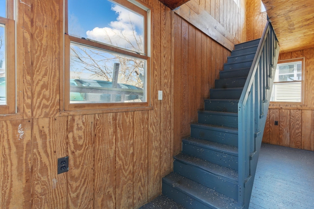 166-168 Corthell Street Springfield, MA 01151 - Photo 30 of 33 a view of staircase with wooden floor and a window