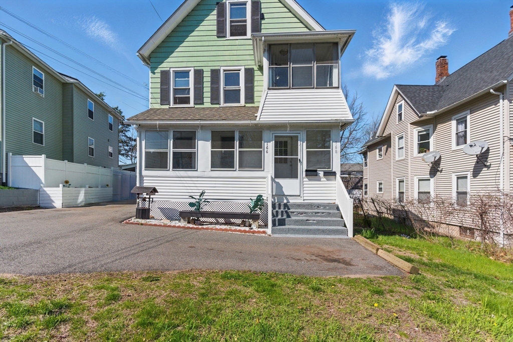 166-168 Corthell Street Springfield, MA 01151 - Photo 3 of 33 a front view of a house with a yard