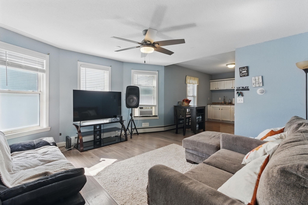 166-168 Corthell Street Springfield, MA 01151 - Photo 6 of 33 a living room with furniture and a flat screen tv