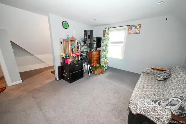 a bedroom with furniture and a window