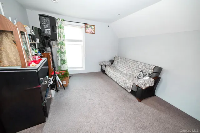 a bed sitting in a room next to a window