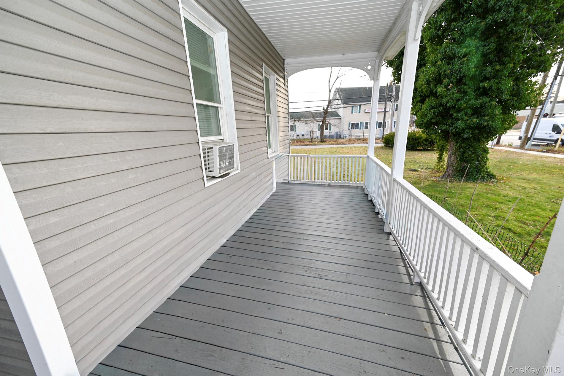 45 Rider Avenue Patchogue, NY 11772 - Photo 26 of 29 a view of a balcony with wooden floor
