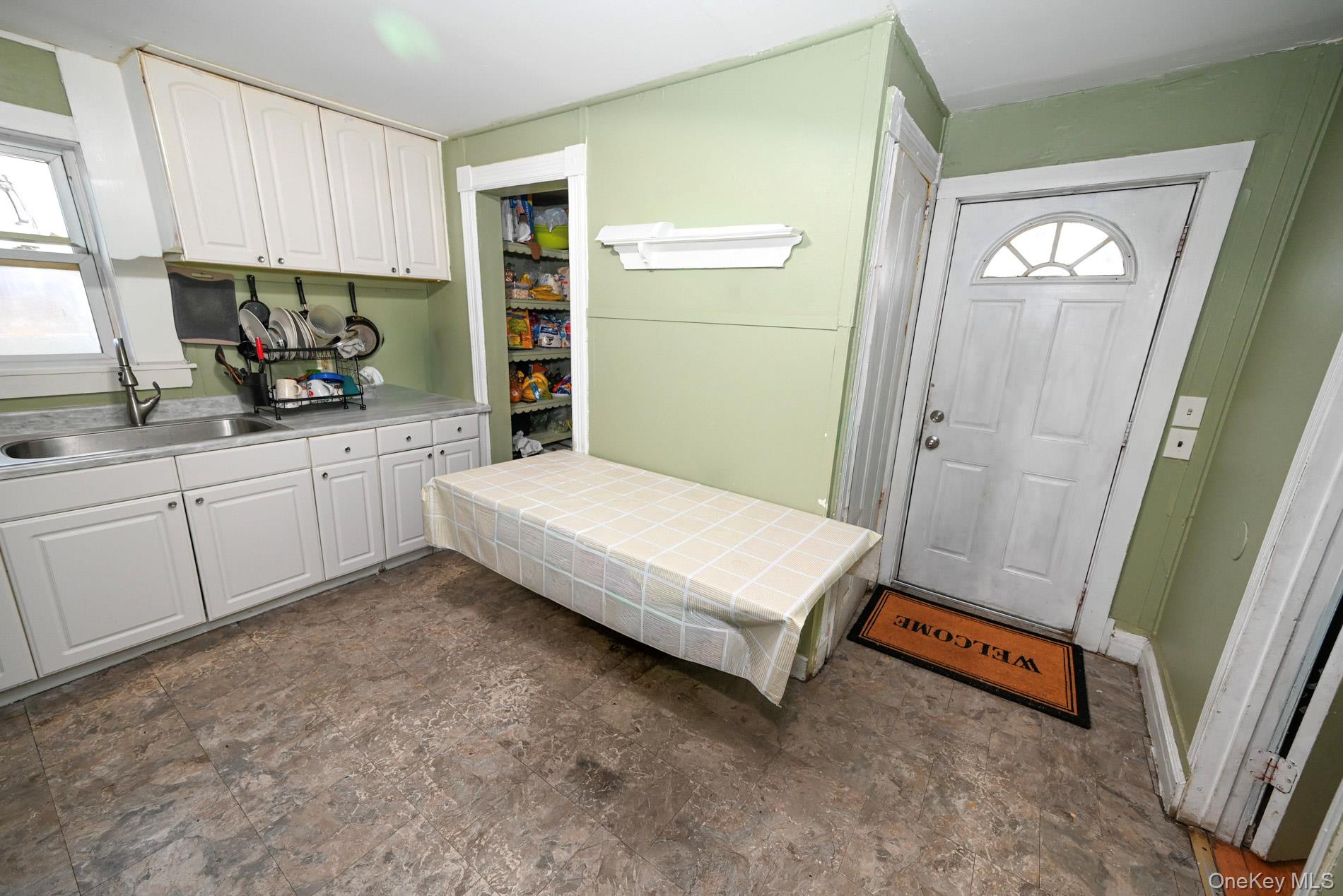 45 Rider Avenue Patchogue, NY 11772 - Photo 4 of 29 a spacious bedroom with a bed and a window