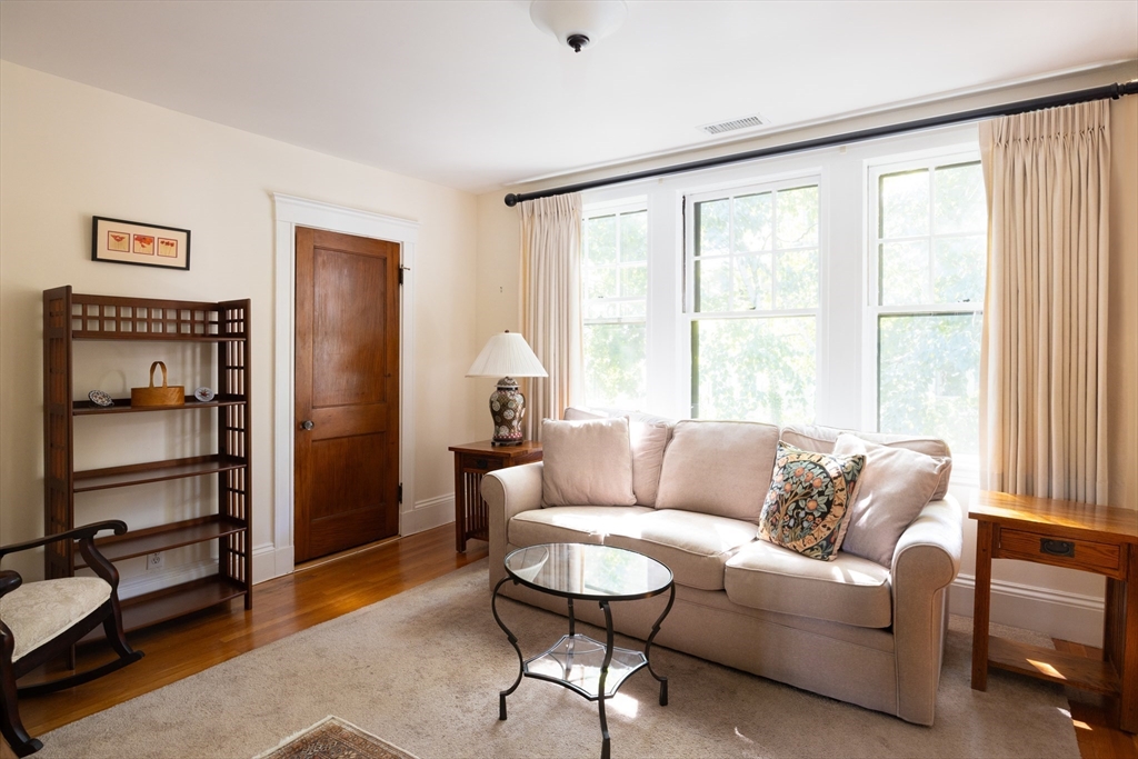139 University Road, Unit 2 Brookline, MA 02445 - Photo 13 of 16 a living room with furniture and a window