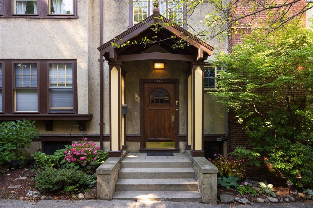 139 University Road, Unit 2 Brookline, MA 02445 - Photo 15 of 16 a front view of a house with potted plants