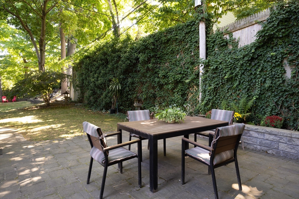 139 University Road, Unit 2 Brookline, MA 02445 - Photo 16 of 16 a view of a backyard with furniture