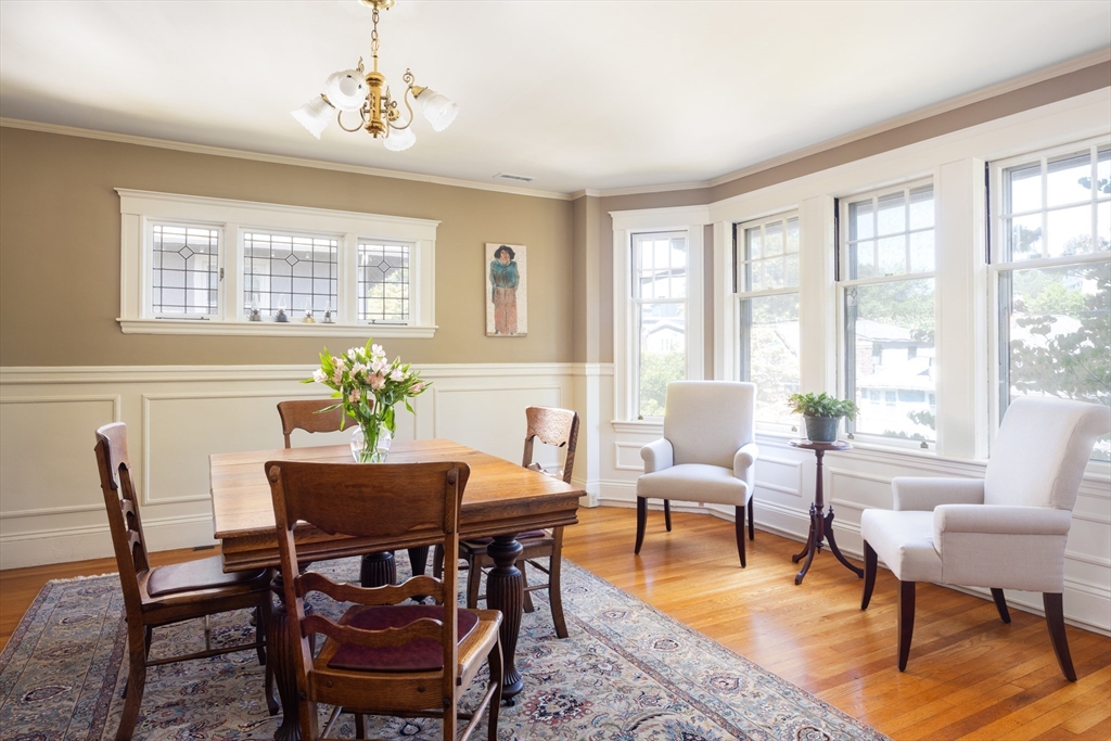 139 University Road, Unit 2 Brookline, MA 02445 - Photo 5 of 16 a view of a dining room with furniture window and outside view